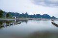 At shrimps pond in the rainy season,and paddle wheel aerator Royalty Free Stock Photo