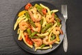 Shrimps prepared with asparagus, tomatoes and paprika.