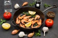 Shrimps with rosemary sprigs and lemon in frying pan Royalty Free Stock Photo