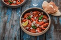 Shrimps saganaki with feta cheese on a plate on a table Royalty Free Stock Photo