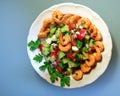 Shrimps salad plate on blue Royalty Free Stock Photo
