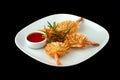 Shrimps with sauce on a white dish Royalty Free Stock Photo