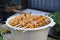 Shrimps on skewers are ready for preparation on fire. Royalty Free Stock Photo