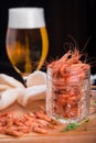 Shrimps on a wooden board end glass of beer Royalty Free Stock Photo