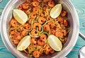 Shrimps and zucchini cut as noodles in pan, toned Royalty Free Stock Photo