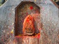 Shrine covered in vermillion to worship Goddess Kali in Dhulikhel, Nepal Royalty Free Stock Photo