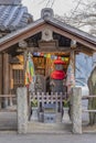 Shrine dedicated to Jizo statues symbol of filial piety to protect children and decorated with thousnd cranes origami in the