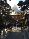 Tourist in Shrine with beautiful sunset fuahimi inari shrine , kyoto, japan