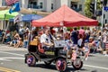 Shriners driving tiny cars in a parade