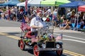 Shriners in tiny cars in a parade