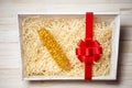 A shrivel dry corn cob in the gift box