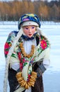 Shrovetide doll with bunch of bagels on neck