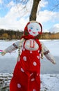 Shrovetide doll in colorful headscarf and sundress