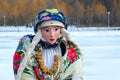 Shrovetide doll in colorful shawls, shirt and fur sleeveless jacket