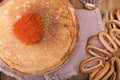 Shrovetide Maslenitsa Week festival meal. Stack of russian pancakes with red caviar. Rustic style, free space for text Royalty Free Stock Photo