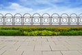 Shrubs and stainless steel fence on blue sky Royalty Free Stock Photo