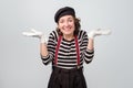 Shrugging caucasian mime woman in doubt doing shrug. Do not know sign Royalty Free Stock Photo