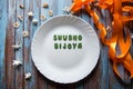 `Shubho Bijoya` a Bengali term translated as `victory of good over evil` on a plate Royalty Free Stock Photo