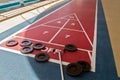 Shuffleboard game ready to play on a cruise ship in the Caribean Sea Royalty Free Stock Photo