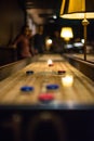 Shuffleboard table with blurred background.. Royalty Free Stock Photo