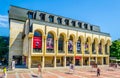 SHUMEN, BULGARIA, AUGUST 3, 2014: People are walking in front of the local cinema in the Bulgarian city Shumen...IMAGE