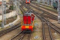 Shunting diesel locomotive tractor at the station rides along the tracks, top view