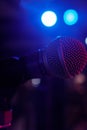 Shure microphone on stage under gig lighting Royalty Free Stock Photo