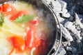 Shurpa soup in a large cast-iron cauldron outdoor. Food for hike. Royalty Free Stock Photo