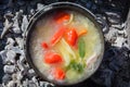 Shurpa soup in a large cast-iron cauldron outdoor. Summer food for hike. Top view. Royalty Free Stock Photo