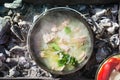 Shurpa soup in a large cast-iron cauldron outdoor. Summer food for hike. Top view. Royalty Free Stock Photo