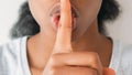 Shush gesture secret sign quiet woman finger lips Royalty Free Stock Photo