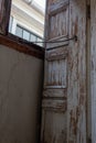 Shutter and clerestory window, peeling paint and water damage Royalty Free Stock Photo