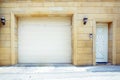 Shutter door or roller door and concrete floor outside .White Automatic shutters in a house . gates in the garage . Automatic Royalty Free Stock Photo