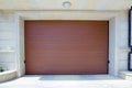 Shutter door or roller door and concrete floor outside .White Automatic shutters in a house . gates in the garage . Automatic Royalty Free Stock Photo
