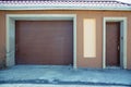 Shutter door or roller door and concrete floor outside .White Automatic shutters in a house . gates in the garage . Automatic Royalty Free Stock Photo
