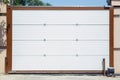 Shutter door or roller door and concrete floor outside .White Automatic shutters in a house . gates in the garage . Automatic Royalty Free Stock Photo