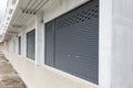 Shutter door or roller door and concrete floor of Commercial Building. Royalty Free Stock Photo