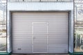 Shutter door or roller door in greenhouse building facade
