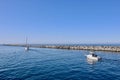 Boats going out to see by a jetty