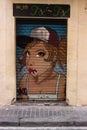 A shutter vandalized with street graffiti art