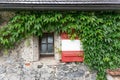 Shutter on the window of the castle wall in red and white like the Austrian flag Royalty Free Stock Photo