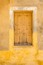 Shutters on wall background. Building exterior of faded wall and shutters. Design in building architecture. Closed Royalty Free Stock Photo