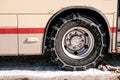 Shuttle bus for tourists There is a chain on the wheel. To prevent the flow on the road. Royalty Free Stock Photo