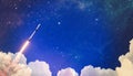 Shuttle launch in the clouds to outer space. Dark space with stars on background.Spaceship flight. Elements of this image