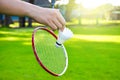 Shuttlecock holding by hand in front of the racket and ready to be served Royalty Free Stock Photo