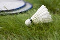 Shuttlecock with two rackets for badminton on the grass. Royalty Free Stock Photo