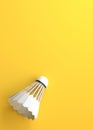 Shuttlecock on yellow background Royalty Free Stock Photo