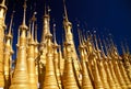 View on isolated countless gold bright pagodas against blue sky