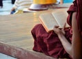 Shwedagon Pagoda March 9 2015 in Yangon. Monks reading book.