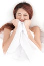 shy asian woman under a duvet Royalty Free Stock Photo